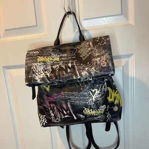 DKNY Black faux leather yellow,pink and white Graffiti prints Medium backpack .